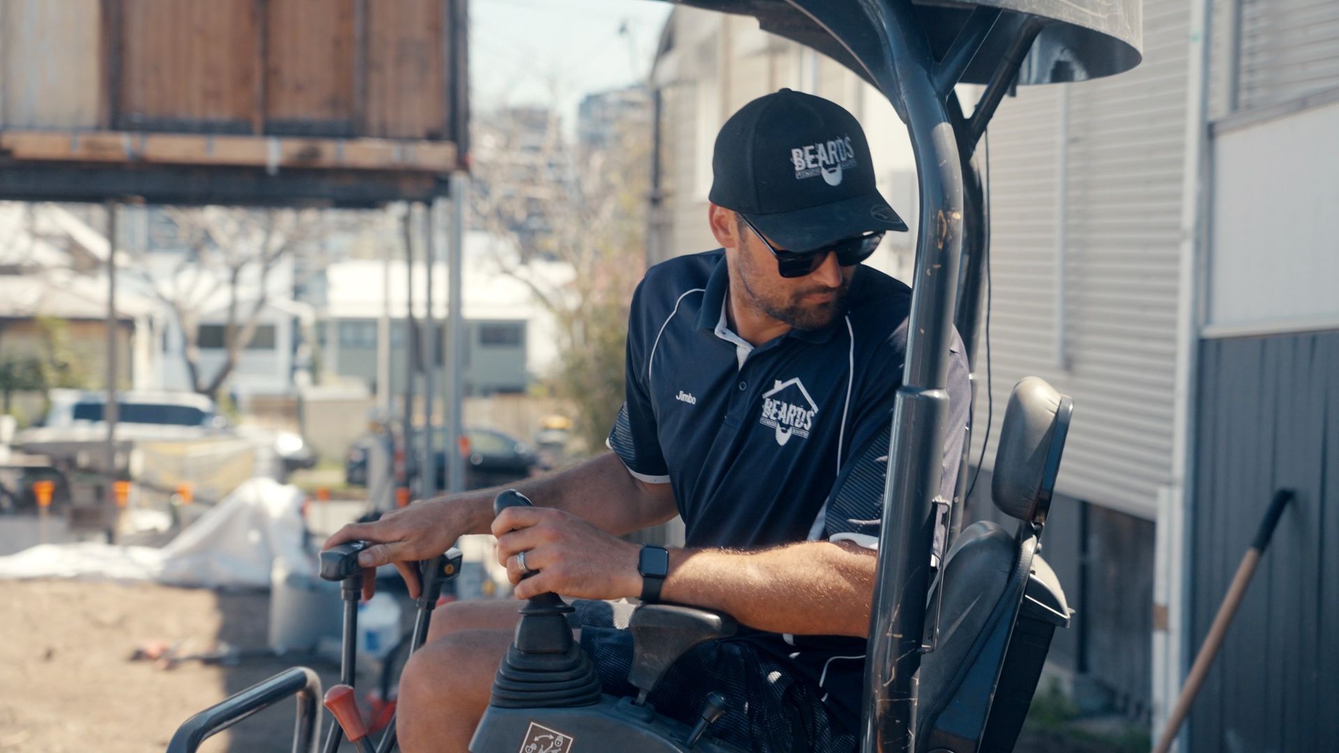 A Plumber On A Mini Excavator Completing A Plumbing Job — Beards Roofing and Plumbing in Bribie Island, QLD