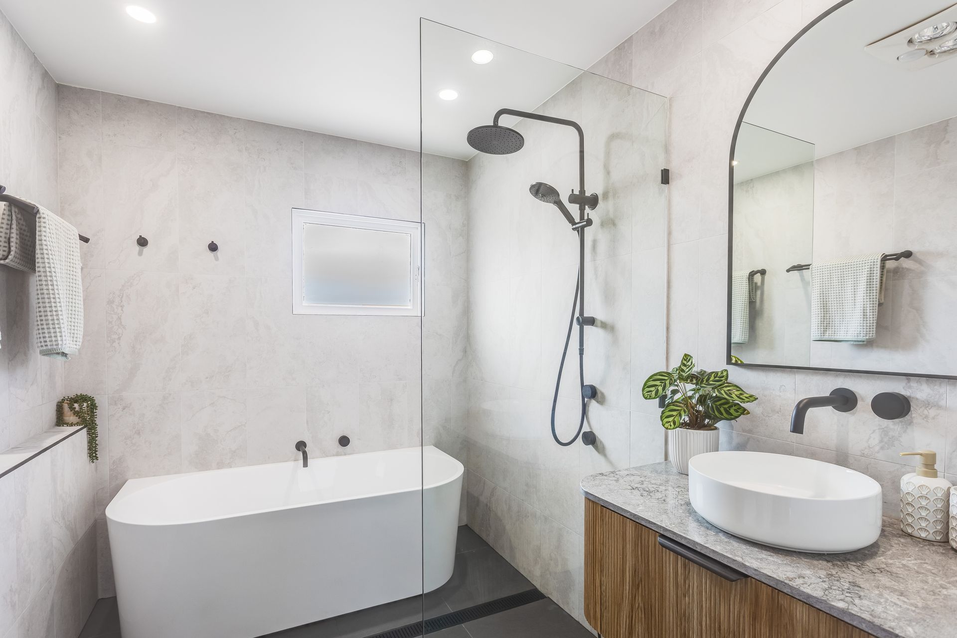 A Bathroom With A Sink, a Bath, a Mirror and a Walk in Shower — Beards Roofing and Plumbing in Sunshine Coast, QLD