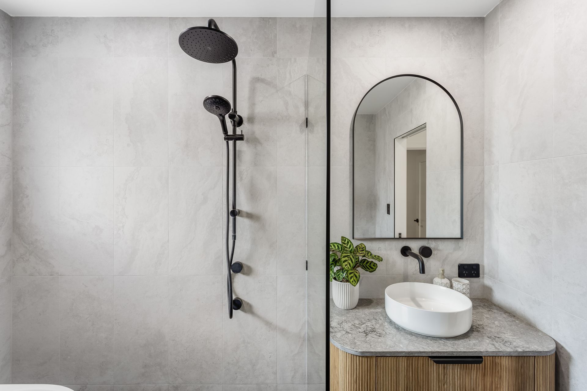 Bathroom With a Shower, Sink and Mirror — Beards Roofing and Plumbing in Clontarf, QLD