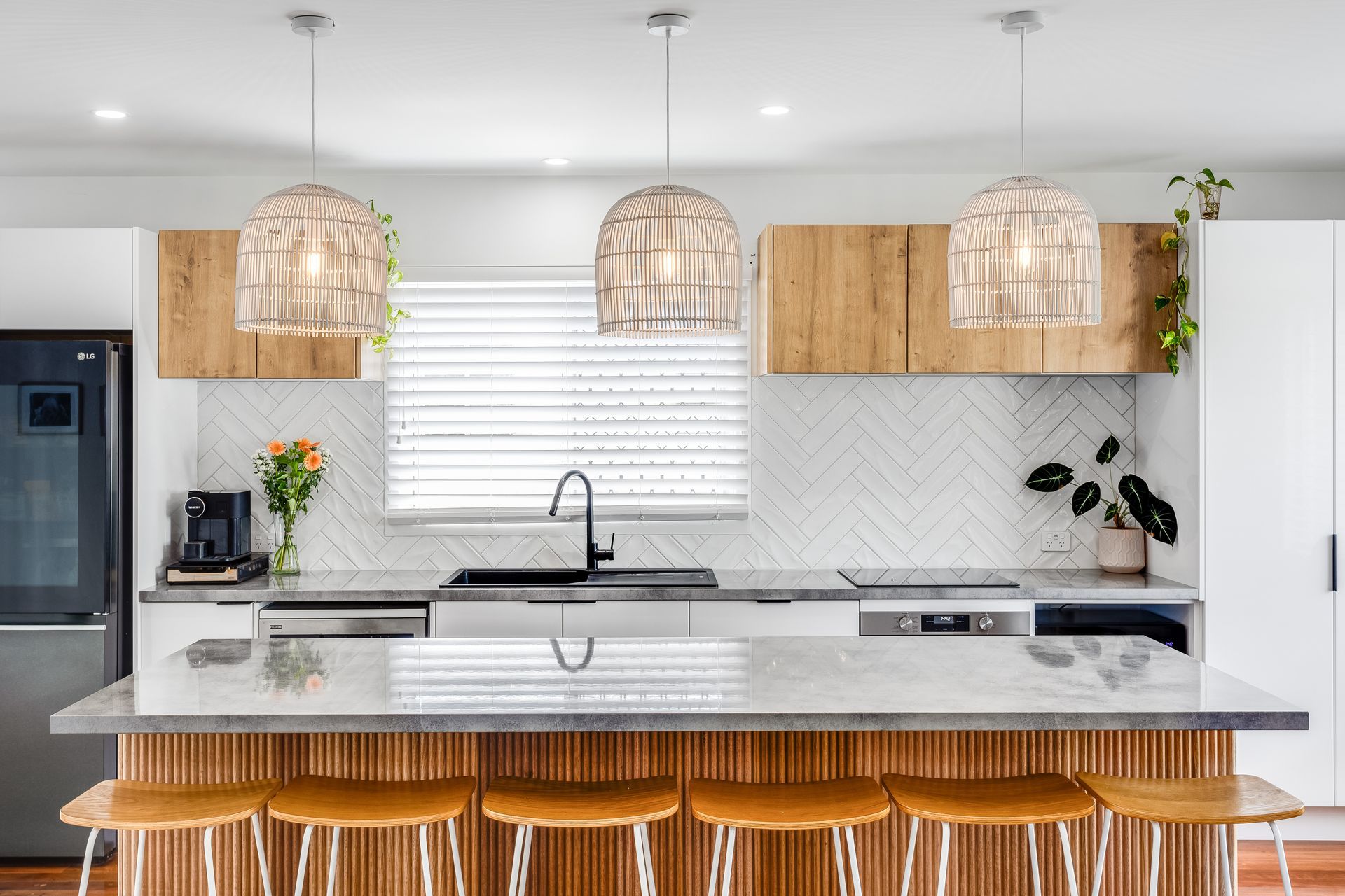 Kitchen With a Large Island and Stools — Beards Roofing and Plumbing in Clontarf, QLD