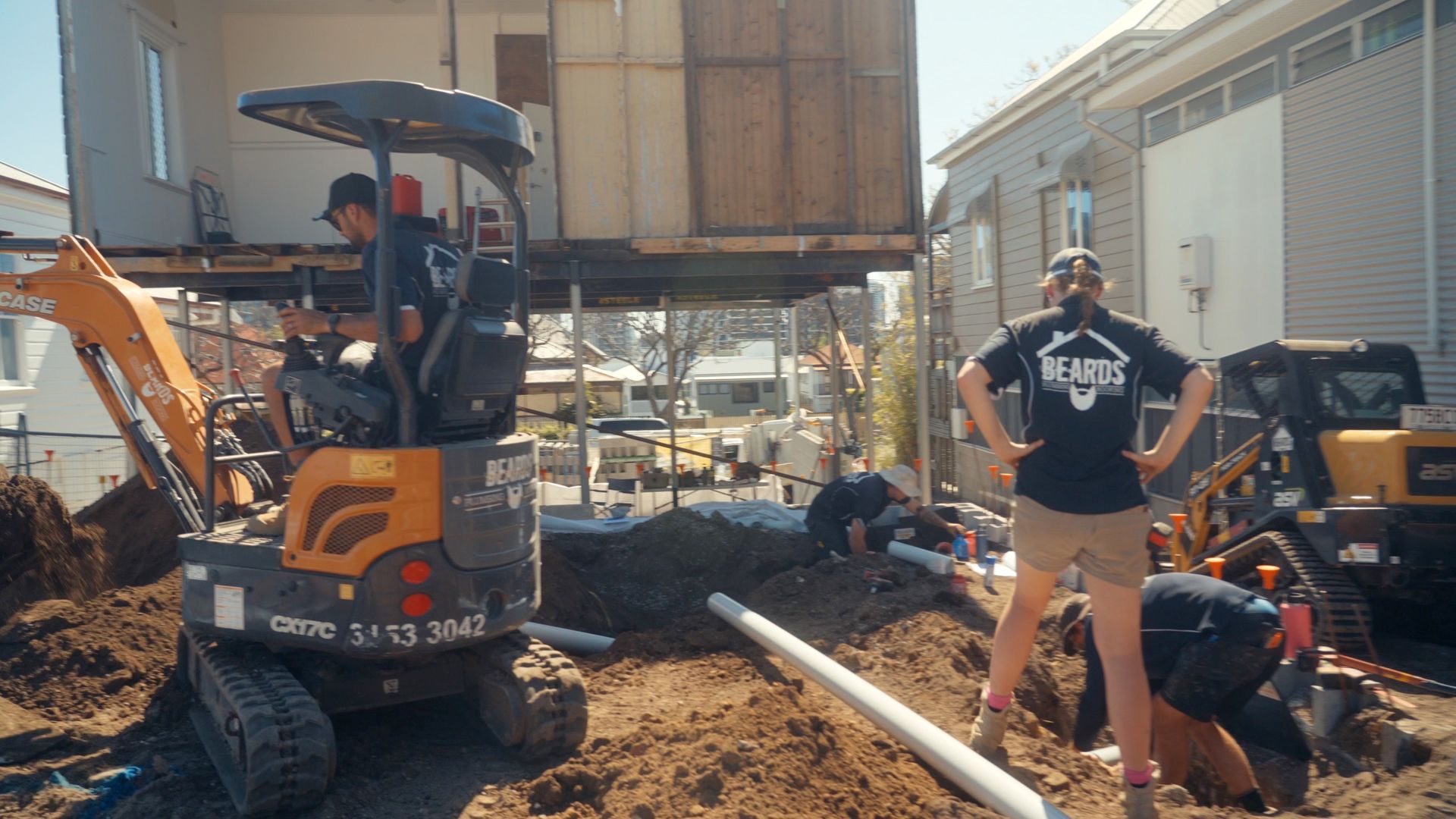 A Team Of Plumbers With Excavators Completing A Plumbing Job — Beards Roofing and Plumbing in Kallangur, QLD