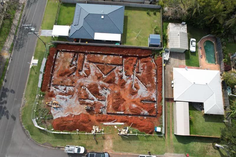 An Aerial View of a House Under Construction in a Residential Area — Beards Roofing and Plumbing in Caboolture, QLD