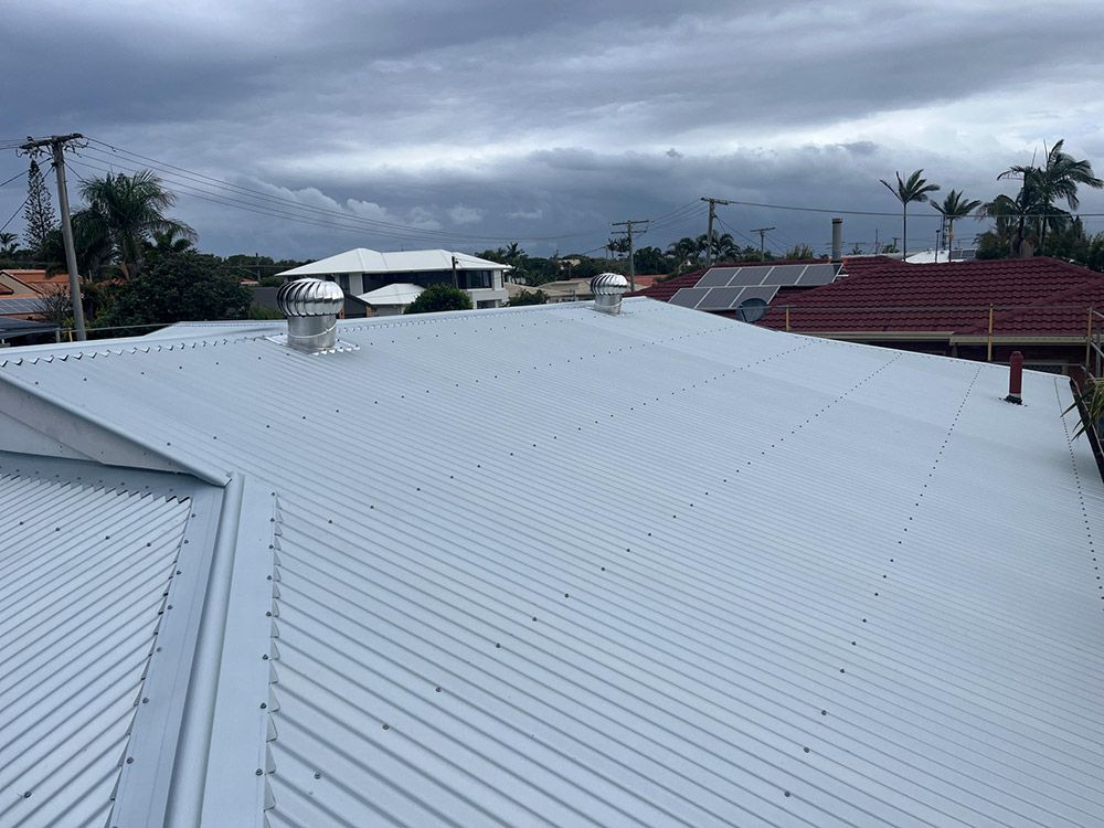 A White Roof With a Lot of Chimneys on It — Beards Roofing and Plumbing in Kallangur, QLD