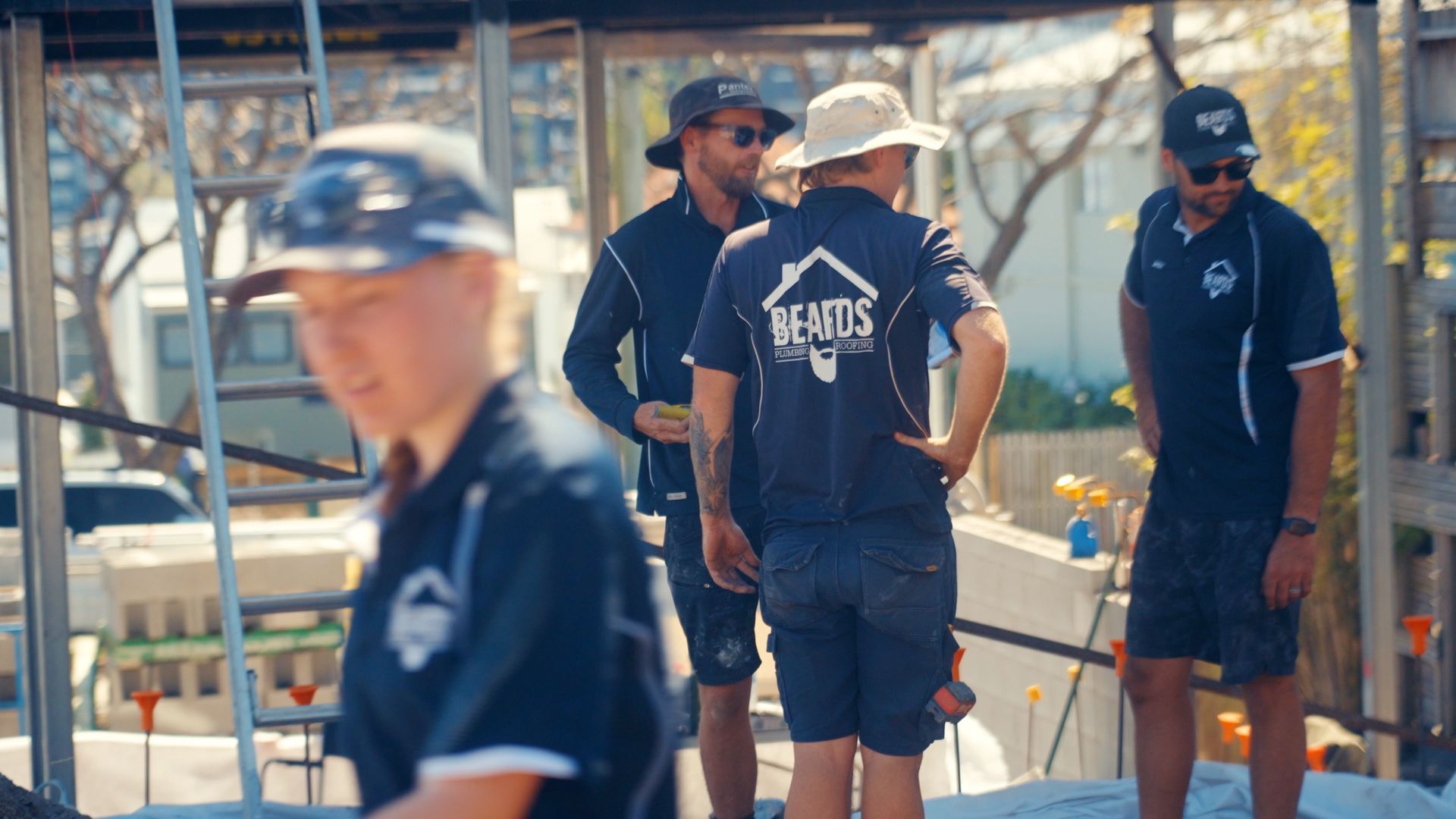 Four Men Completing A Plumbing Job — Beards Roofing and Plumbing in North Lakes, QLD