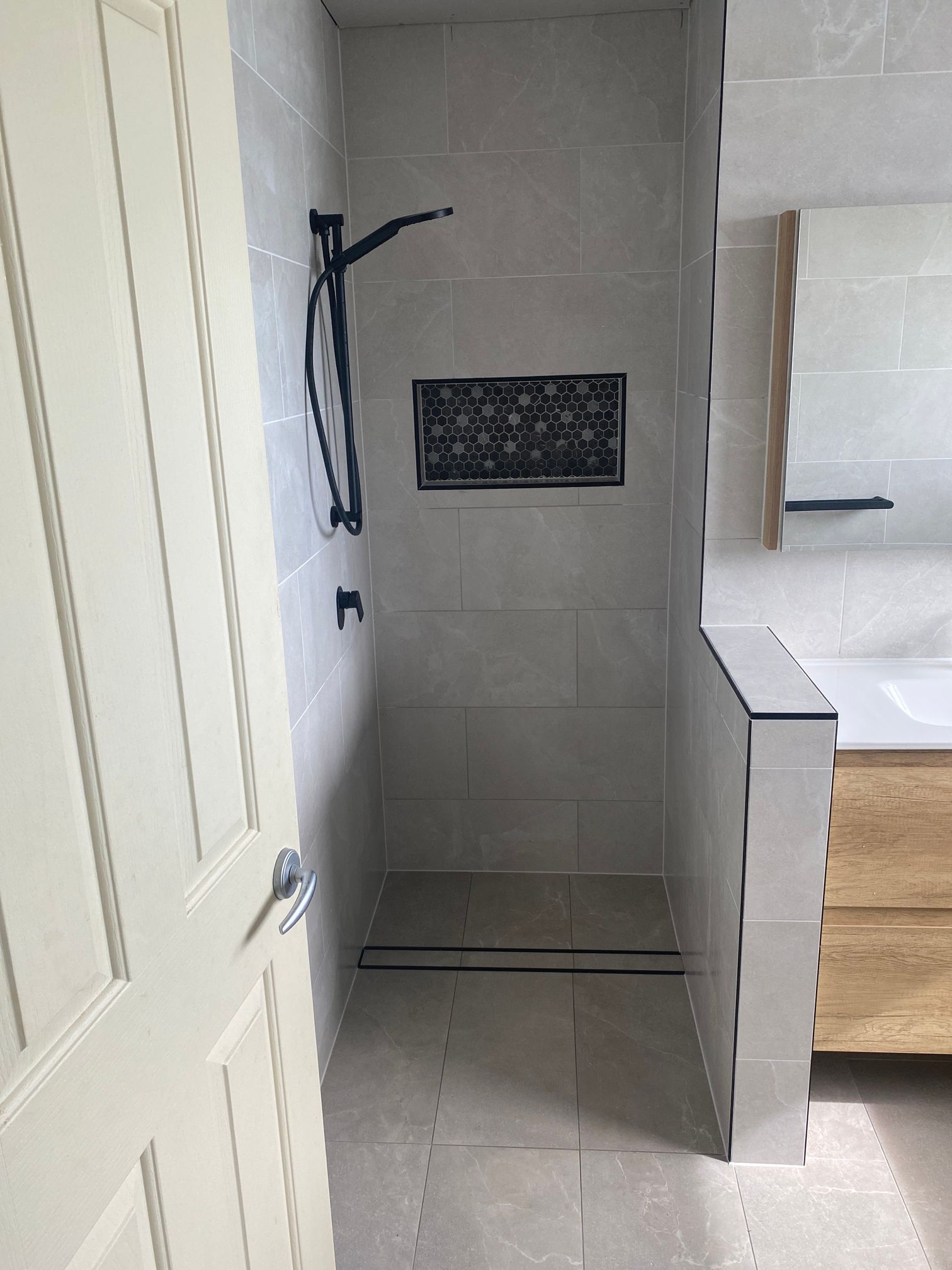 Bathroom With a Walk in Shower and a Sink — Beards Roofing and Plumbing in Clontarf, QLD