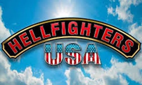 The logo for hellfighters usa is against a blue sky with clouds.