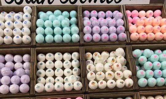 A bunch of boxes filled with balls of different colors.