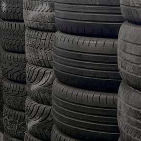 A pile of tires are stacked on top of each other.