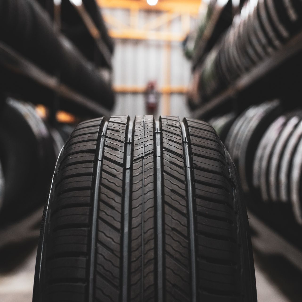 A close up of a tire in a tire store