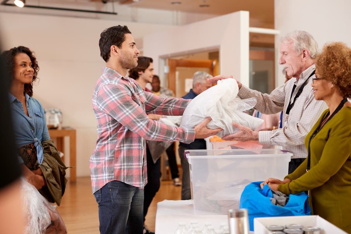 People donating clothing to charity