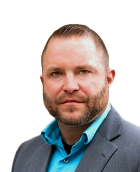 A man with a beard wearing a suit and a blue shirt