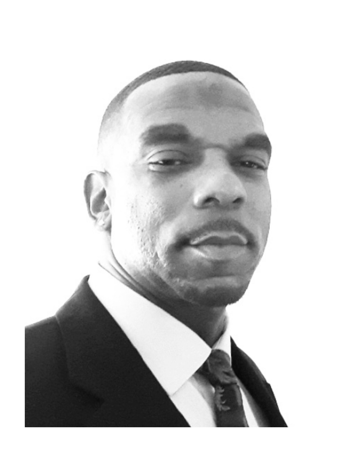 A black and white photo of a man in a suit and tie