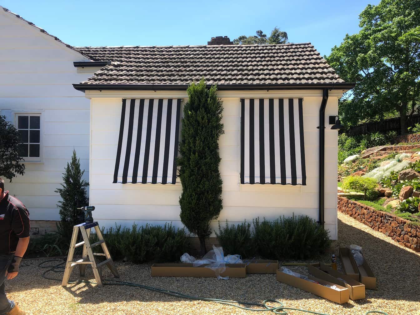 Roll Up Awning Black and White Lines — Window Coverings in Exeter, NSW