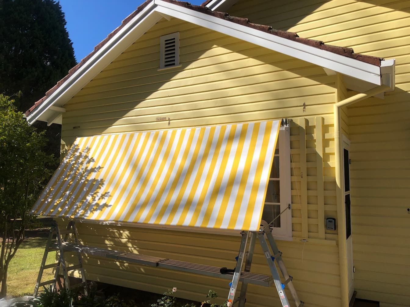 Yellow Stripped Window Awnings — Window Coverings in Exeter, NSW
