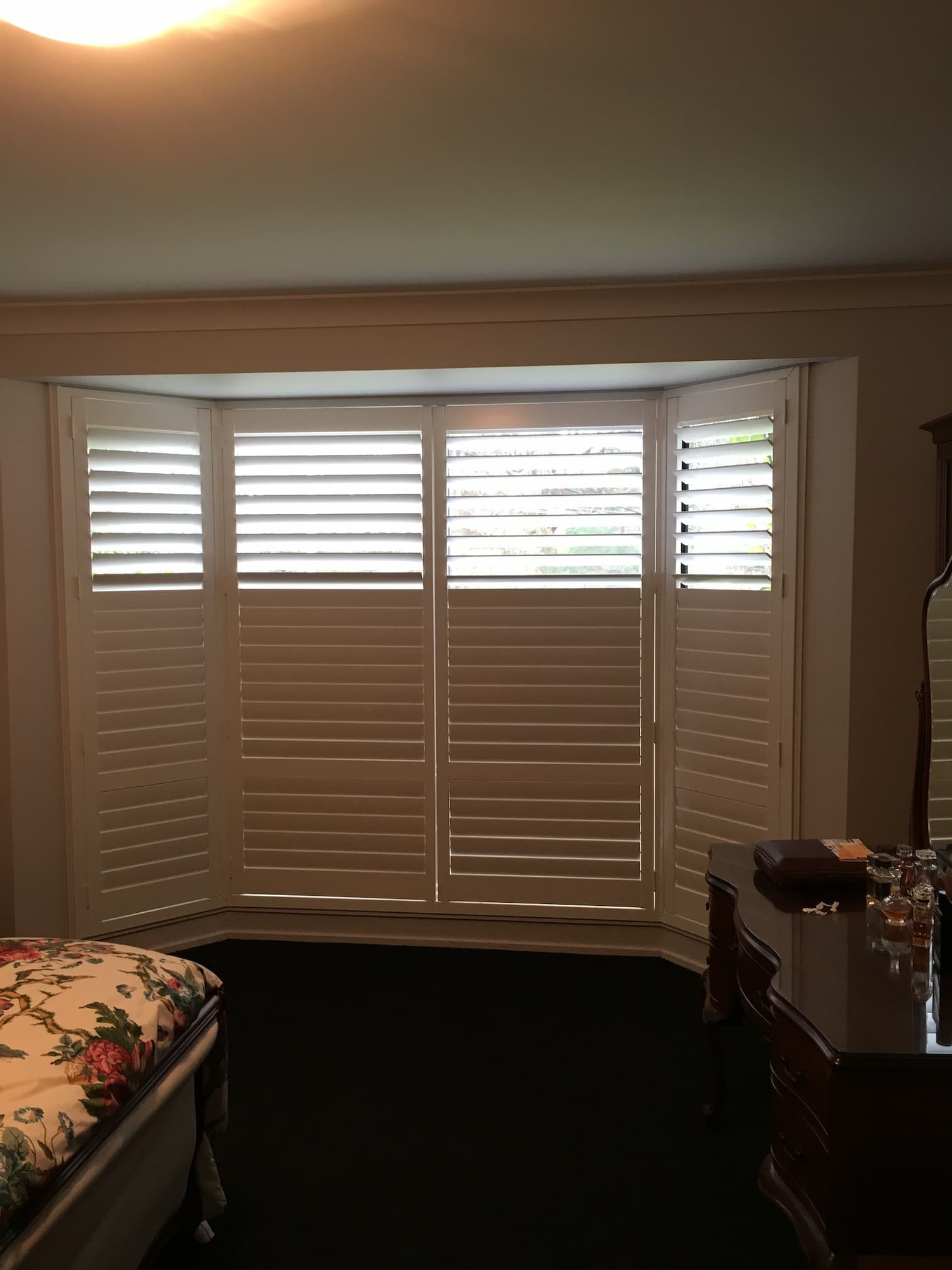 Dim Light Room With Plantation Shutters — Window Coverings in Exeter, NSW