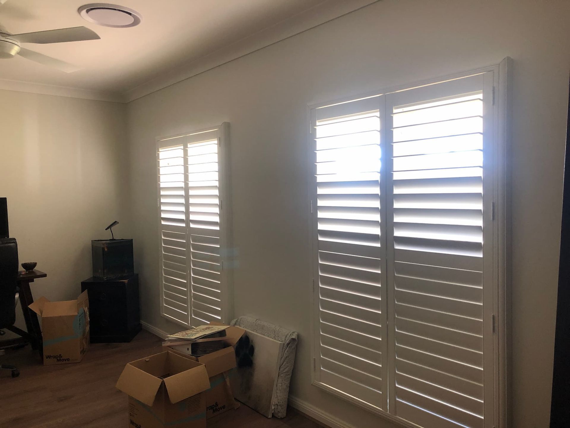 Plantation Shutters On A White Wall — Window Coverings in Exeter, NSW