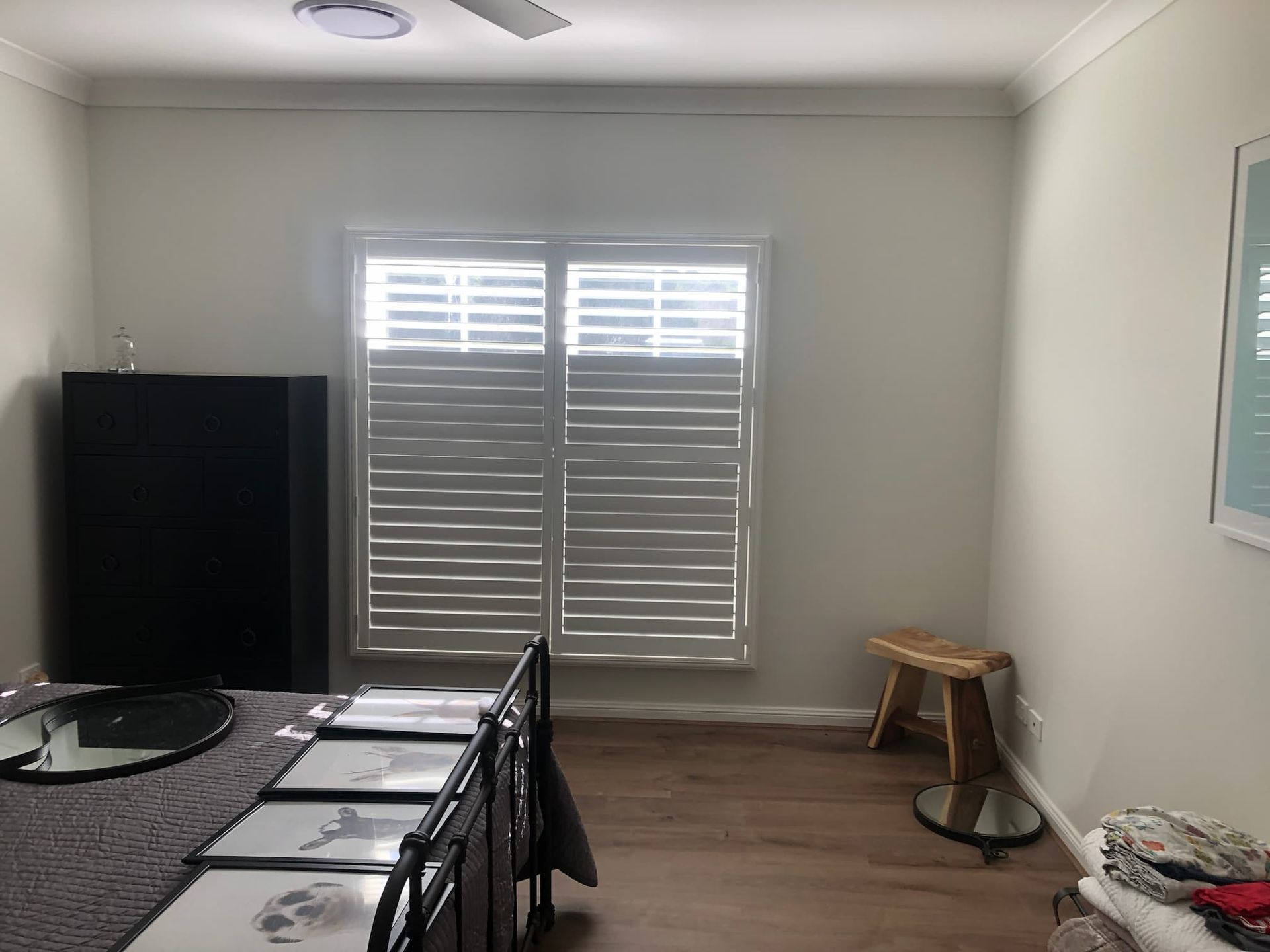 indoor Plantation Shutters On A White Wall — Window Coverings in Exeter, NSW