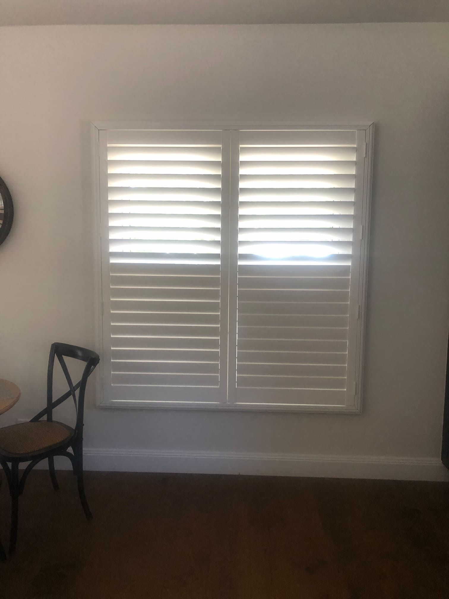 Shutter Blinds On A White Wall — Window Coverings in Exeter, NSW