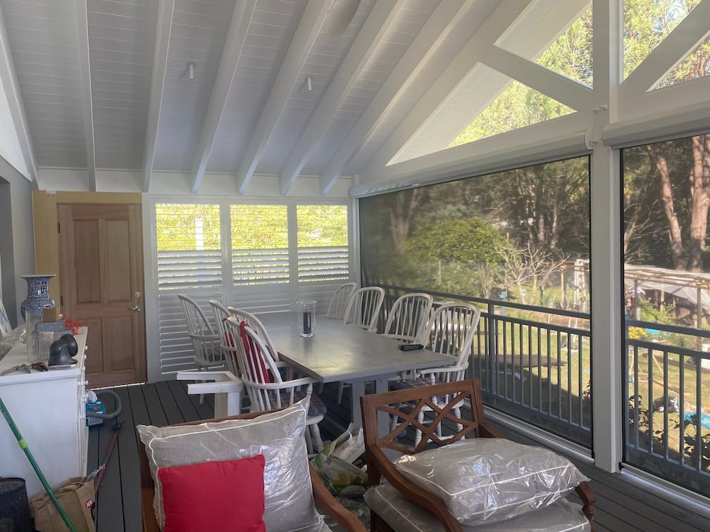 Side View Of Balcony With Shutters — Window Coverings in Exeter, NSW