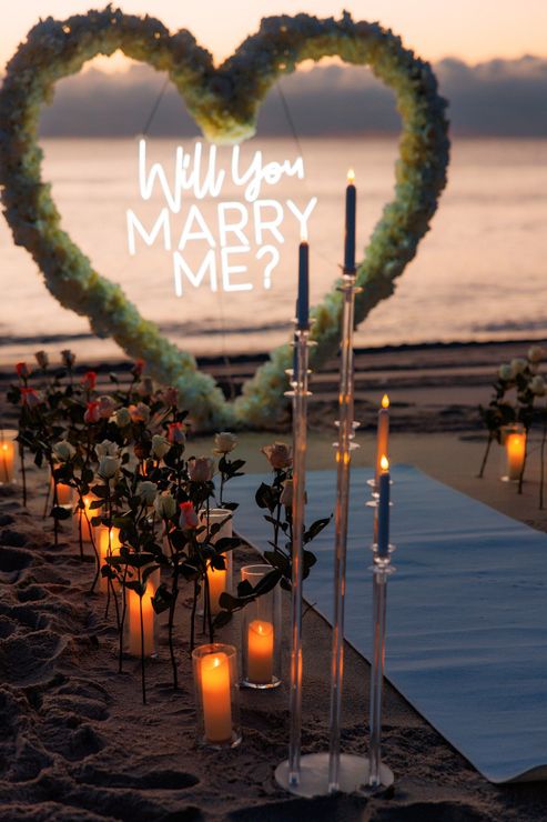 Romantic beach proposal setup: lit 