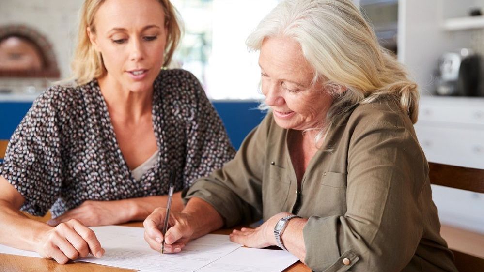 Couple signing first mortgage application