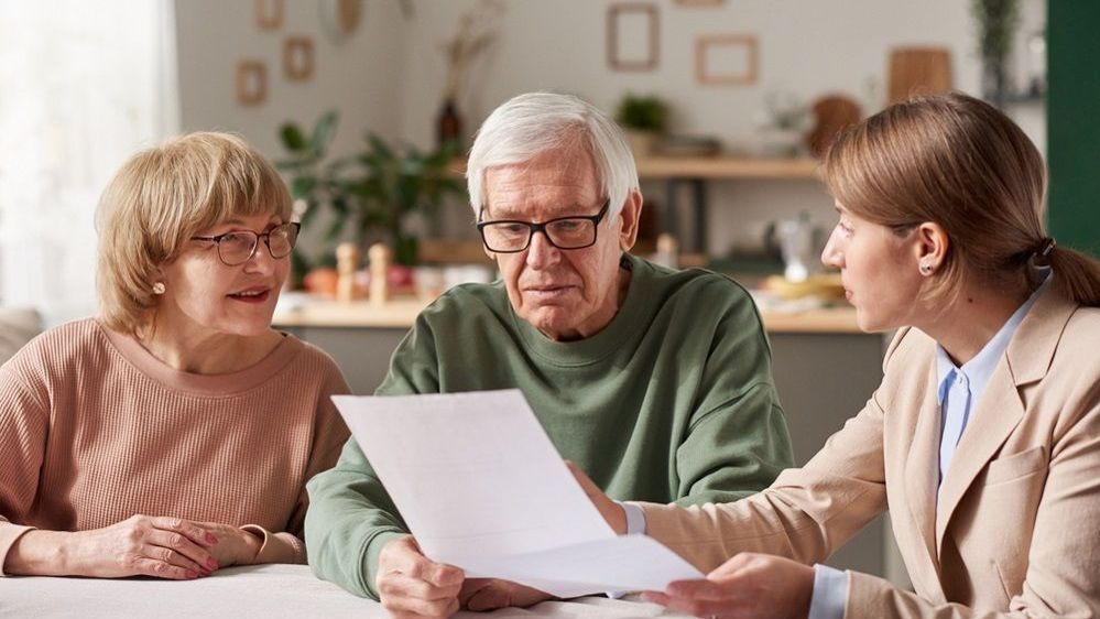 Couple signing first mortgage application