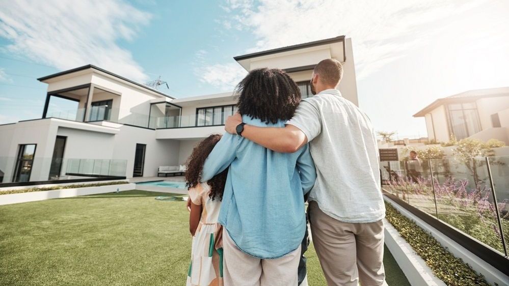 Couple signing first mortgage application