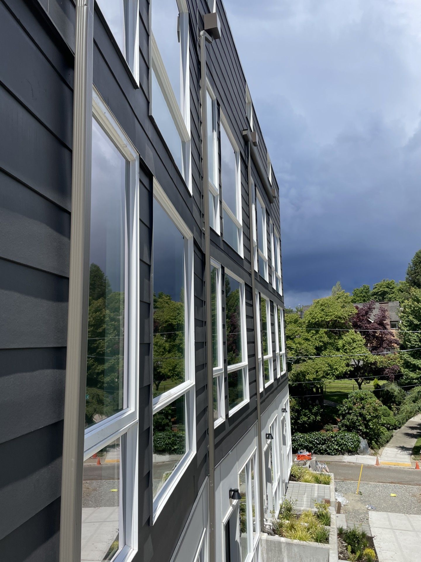A building with a lot of windows and trees in the background