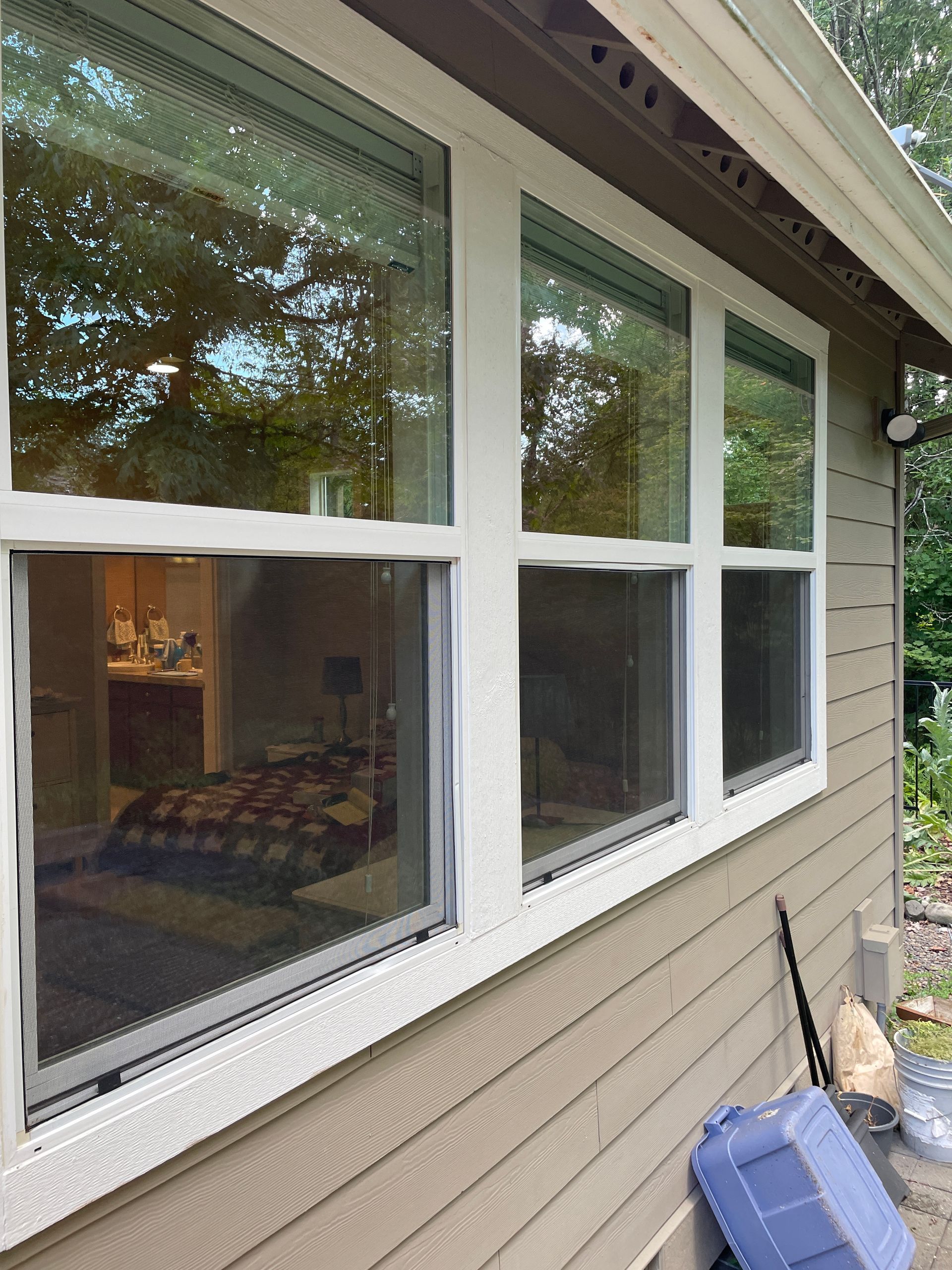 A house with a lot of windows on the side of it.