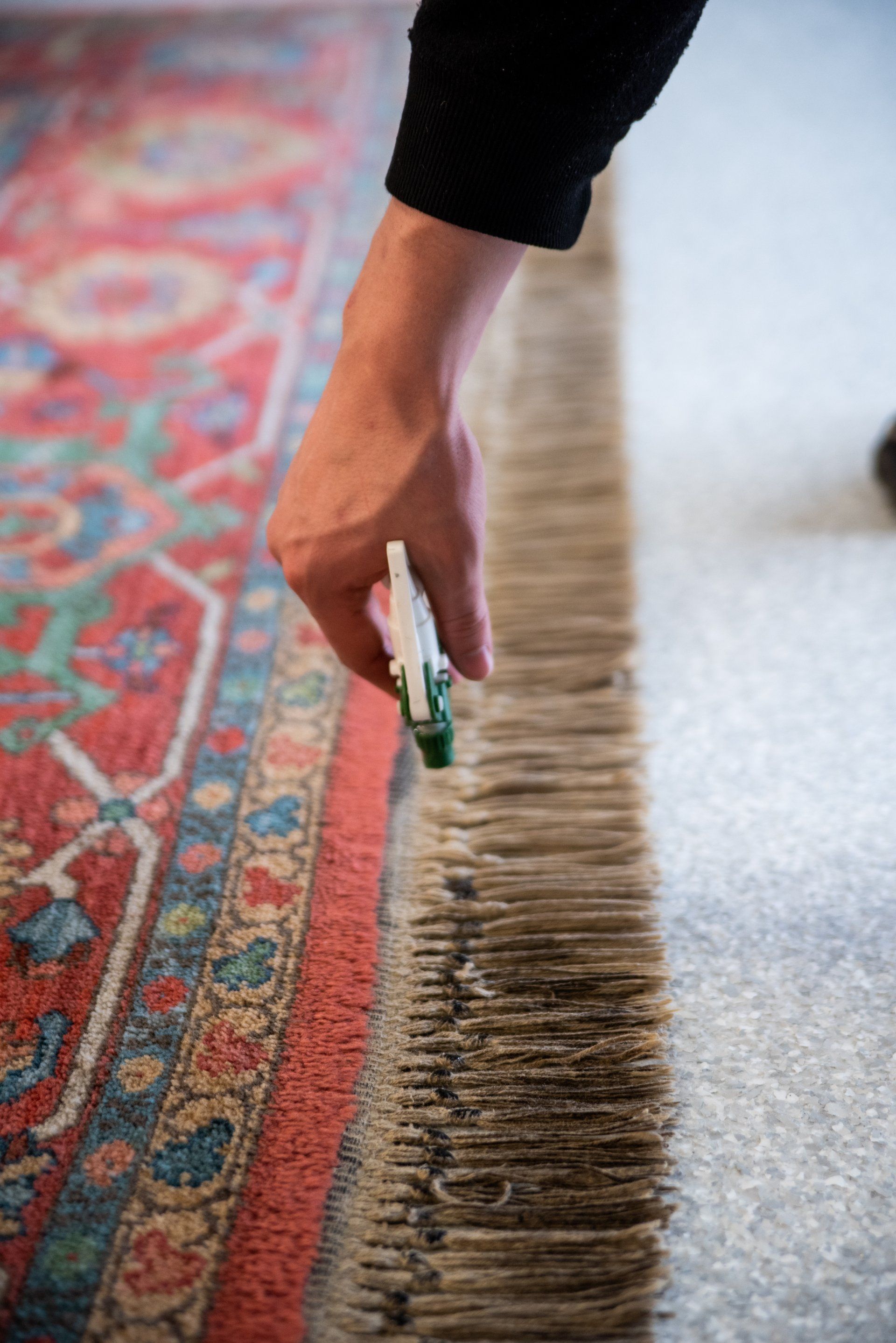 spraying carpet's knots