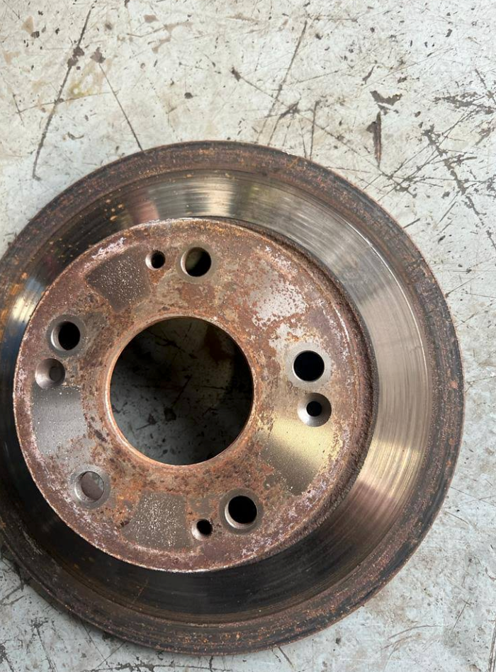 Vehicle Brake Rotor Showing Signs of Heavy Rust and Potential Wear  | Tune-Up Express Auto