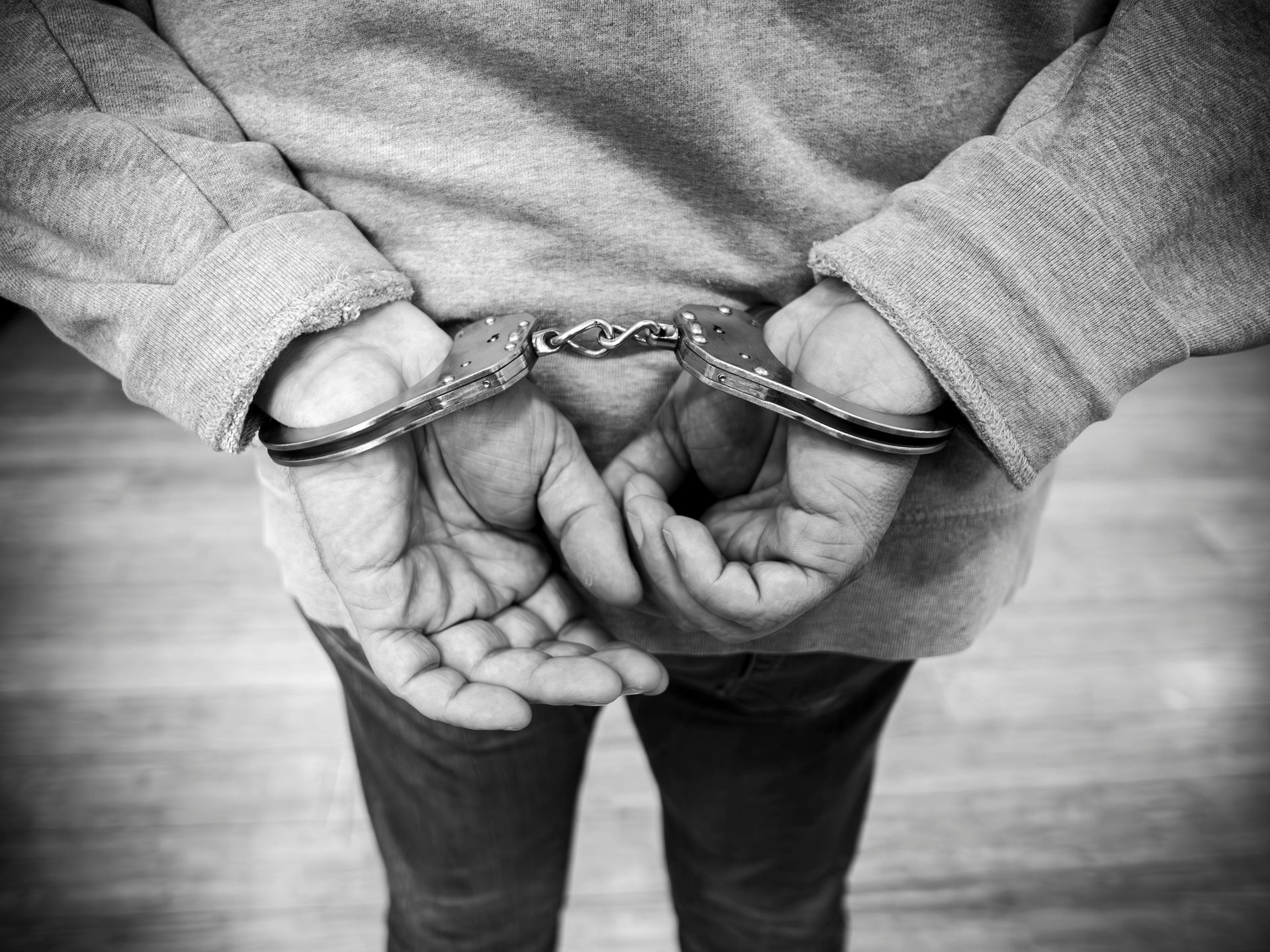 Man With Hands in Handcuffs