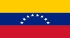 Bandera de Venezuela con franjas horizontales amarillas, azules y rojas y un semicírculo de ocho estrellas blancas.