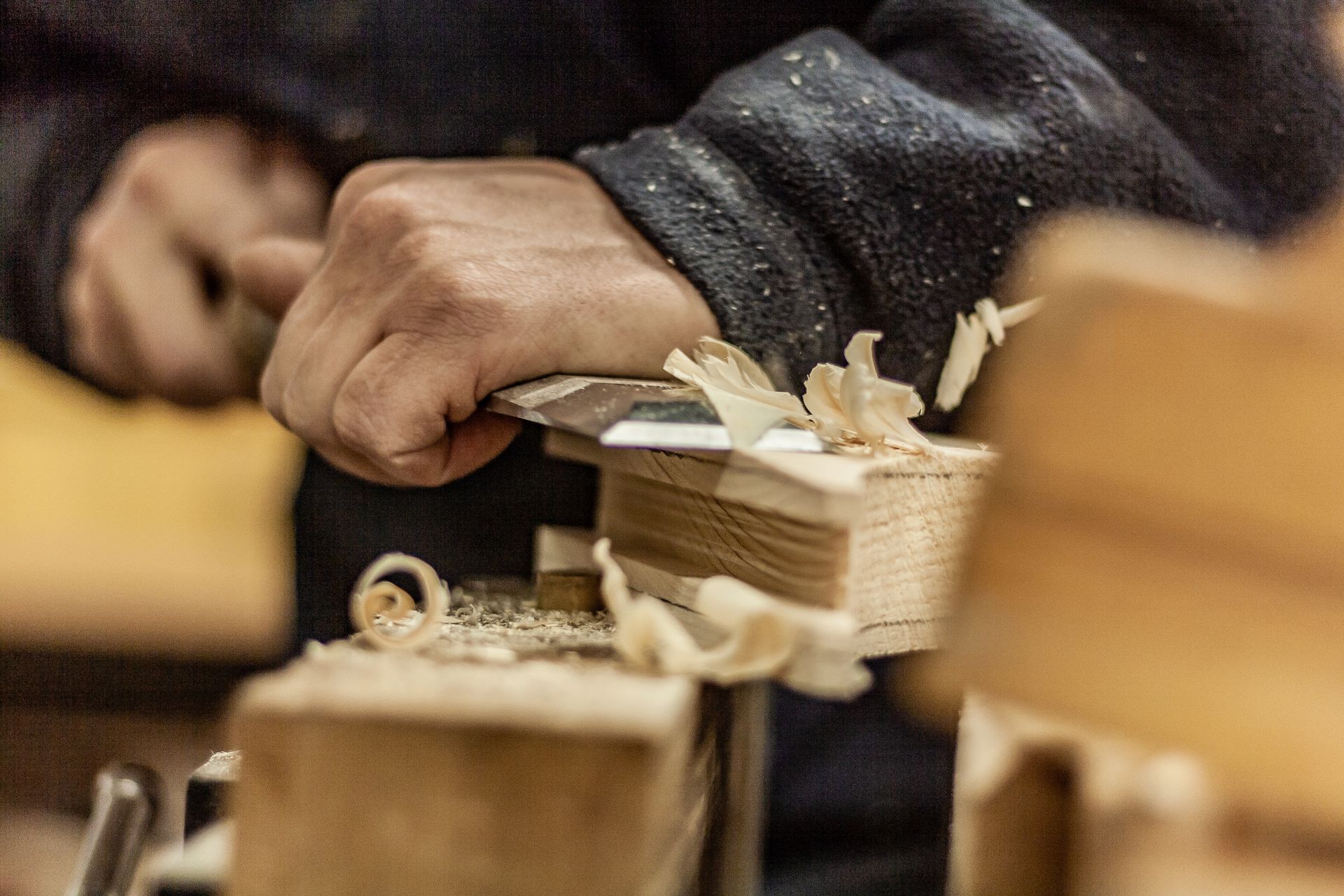 Two men are installing solar panels on a roof