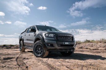 A Black Ford Ranger Raptor Is Parked In The Dirt Road — BOEX Tyres And Performance in Mittagong, NSW