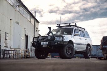 A White SUV with A Roof Rack And Bull Bar — BOEX Tyres And Performance in Bowral, NSW