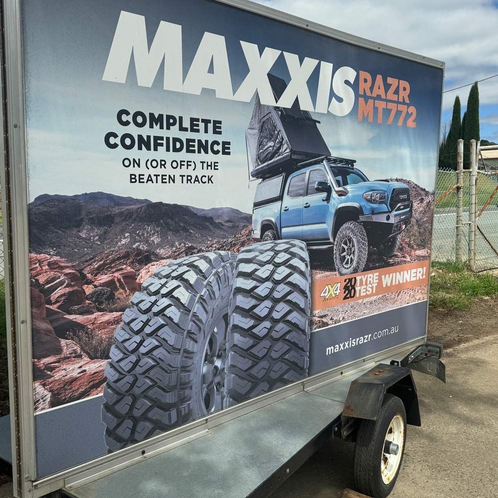 A Trailer With A Maxxis Razr M1772 Advertisement On It — BOEX Tyres And Performance in Bowral, NSW