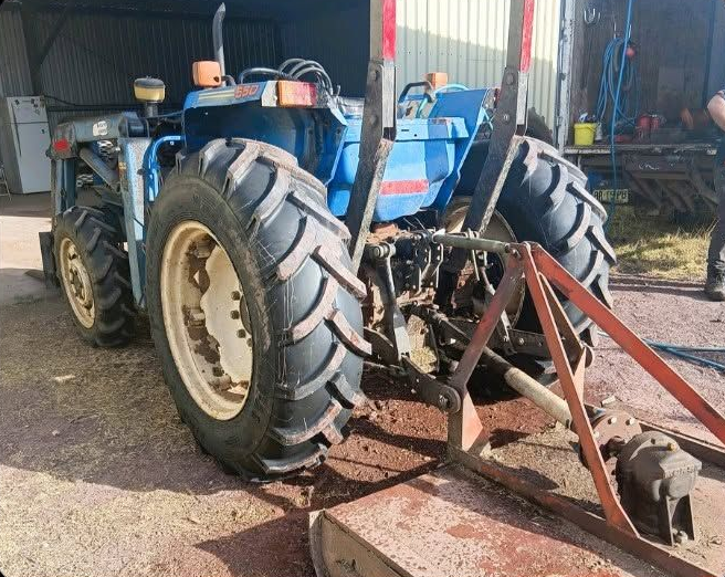 Blue Tractor With Large Rear Tyres Inside a Barn — BOEX Tyres And Performance in Bowral, NSW