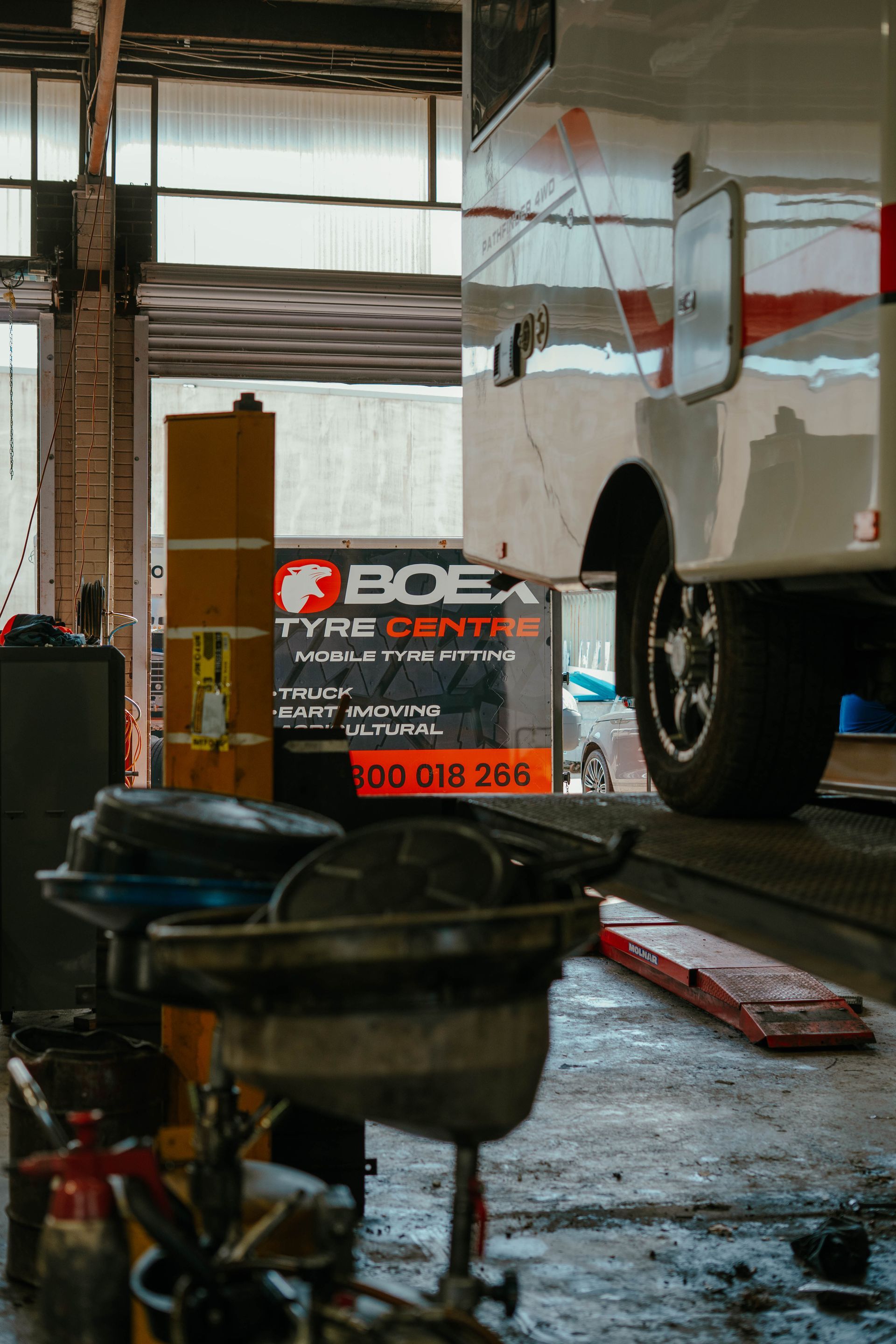 A Close Up Of A Car Tire On A Gravel Road — BOEX Tyres And Performance in Bowral, NSW