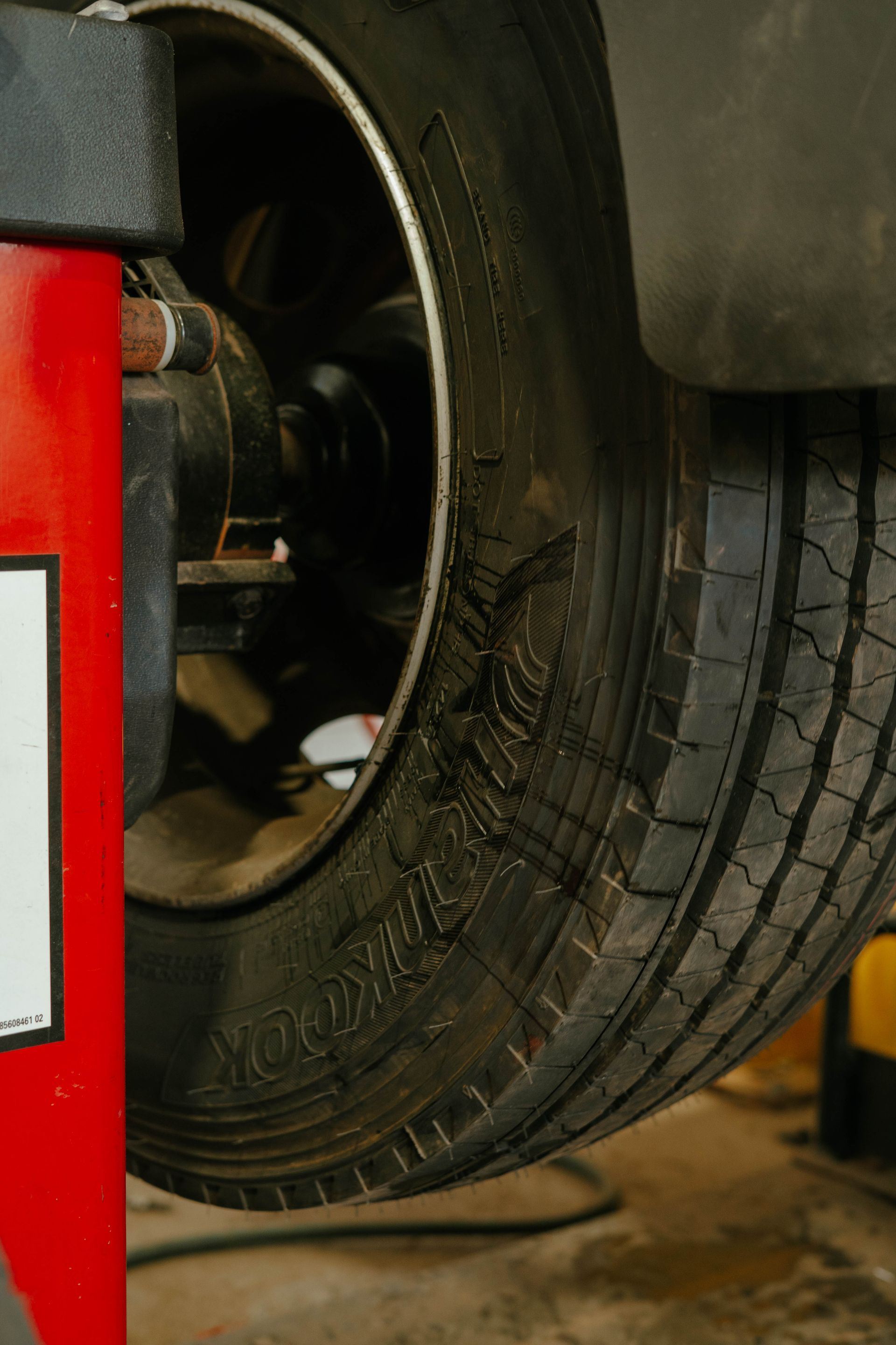 A Tractor Wheel On A Grass Paddock — BOEX Tyres And Performance in Bowral, NSW