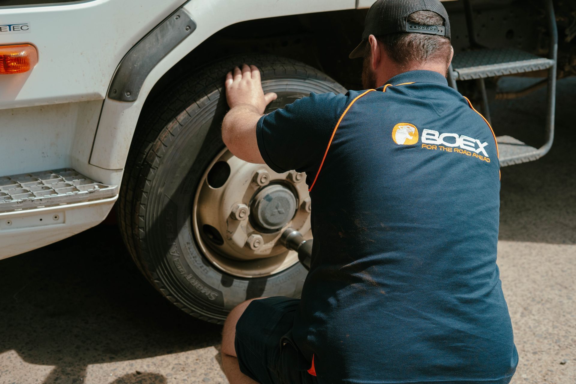 A 4x4 Jeep Is Driving Down A Dirt Road In The Desert — BOEX Tyres And Performance in Mittagong, NSW