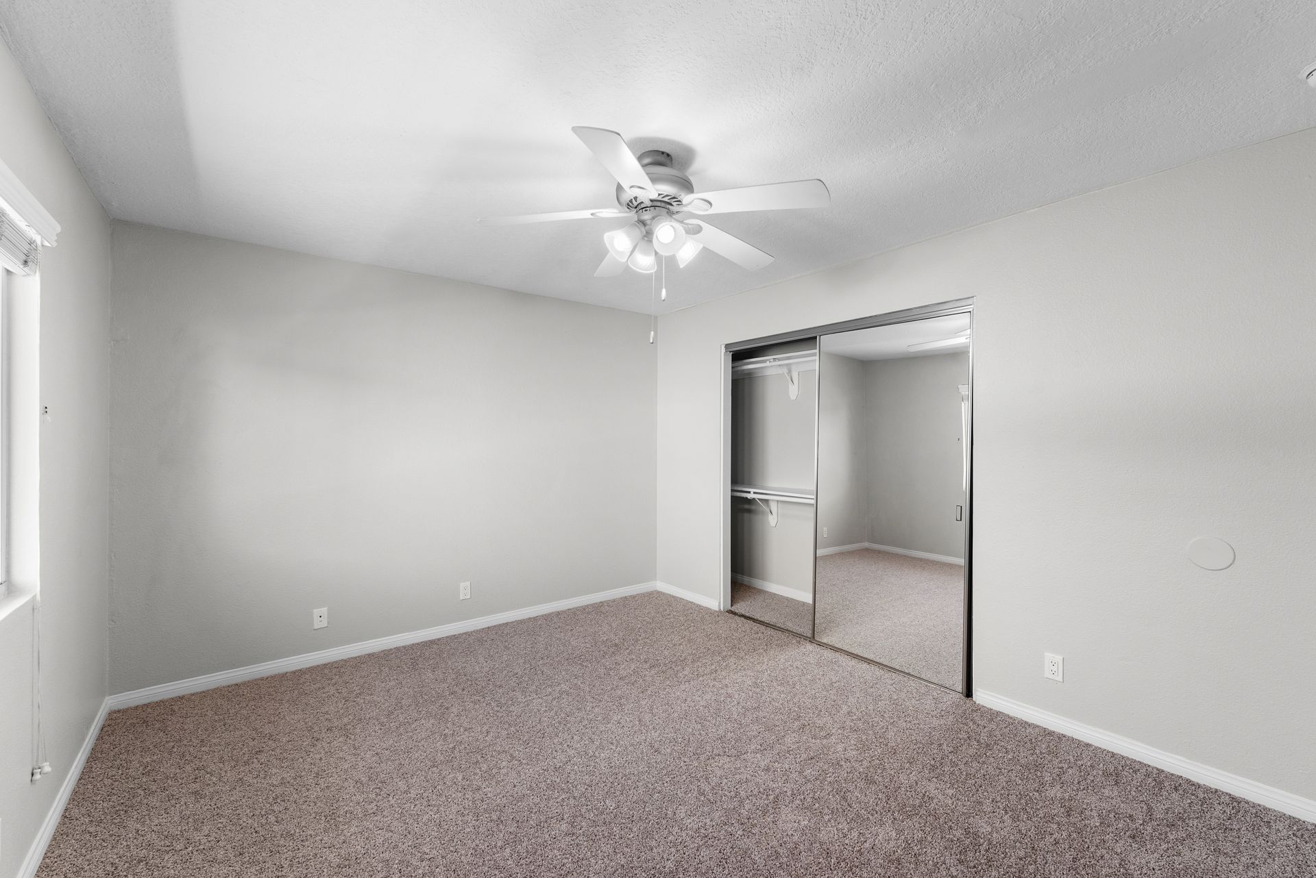 Bedroom with mirrored closet
