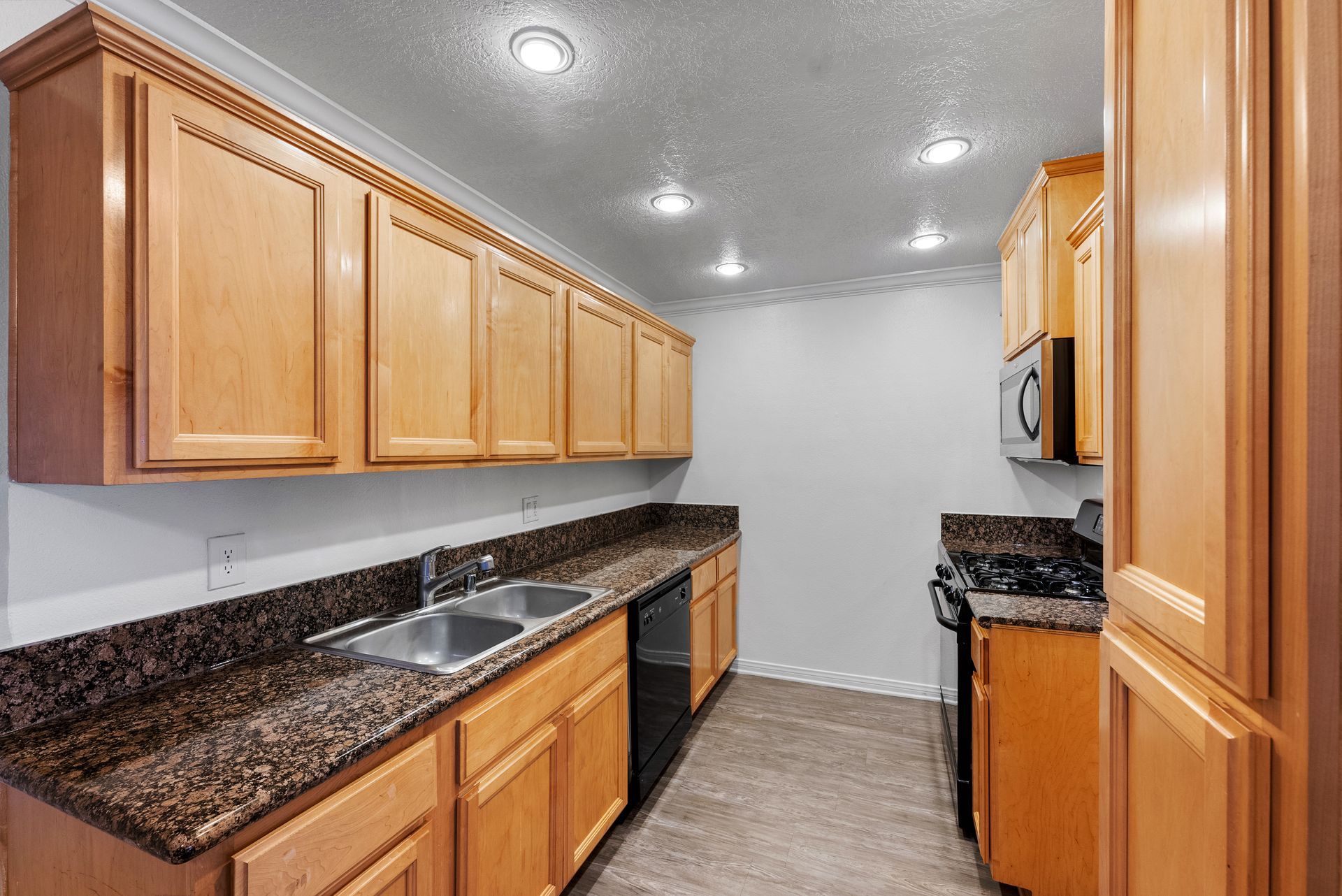 Kitchen with wooden cabinets and sink