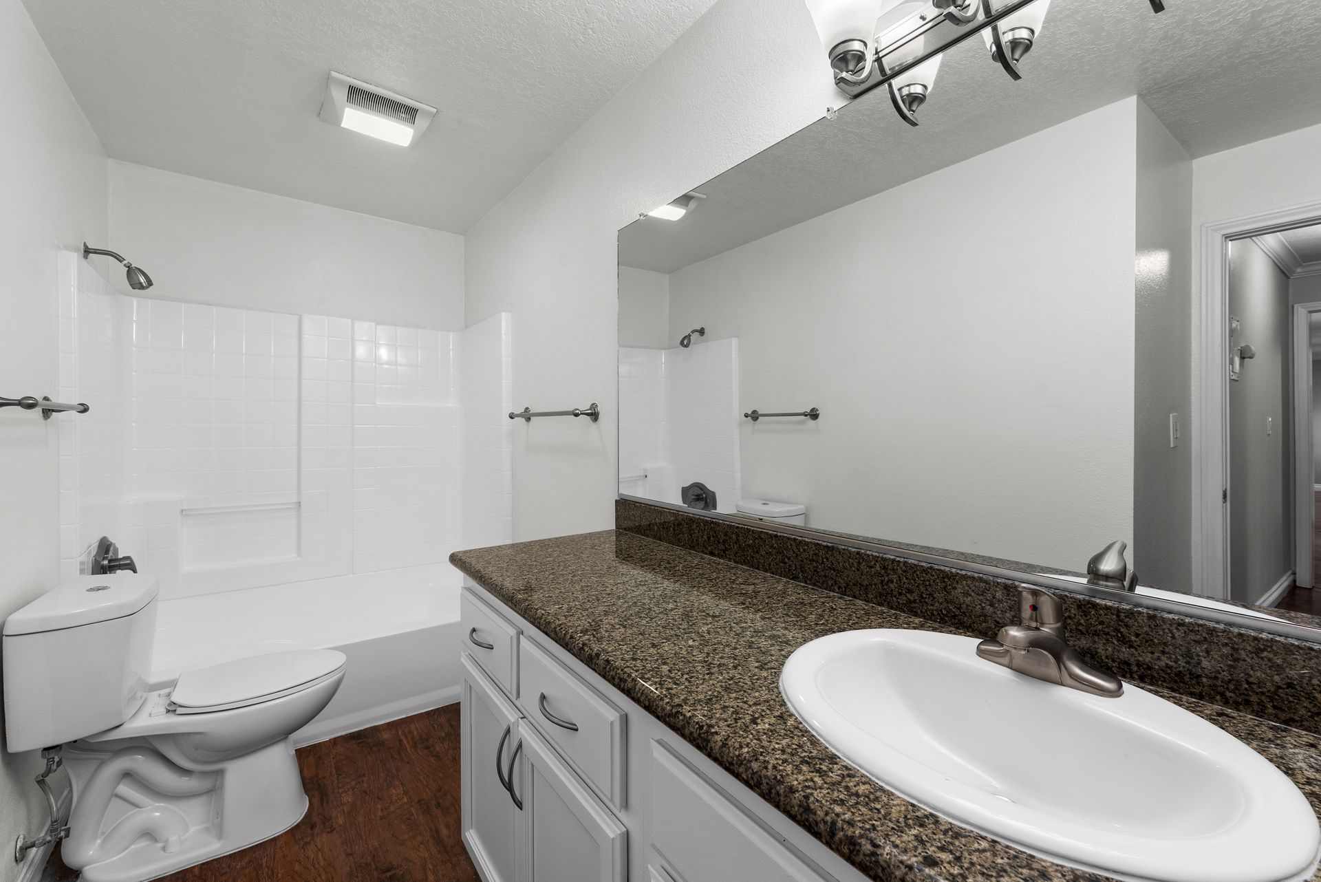 Bathroom with shower, toilet, and sink