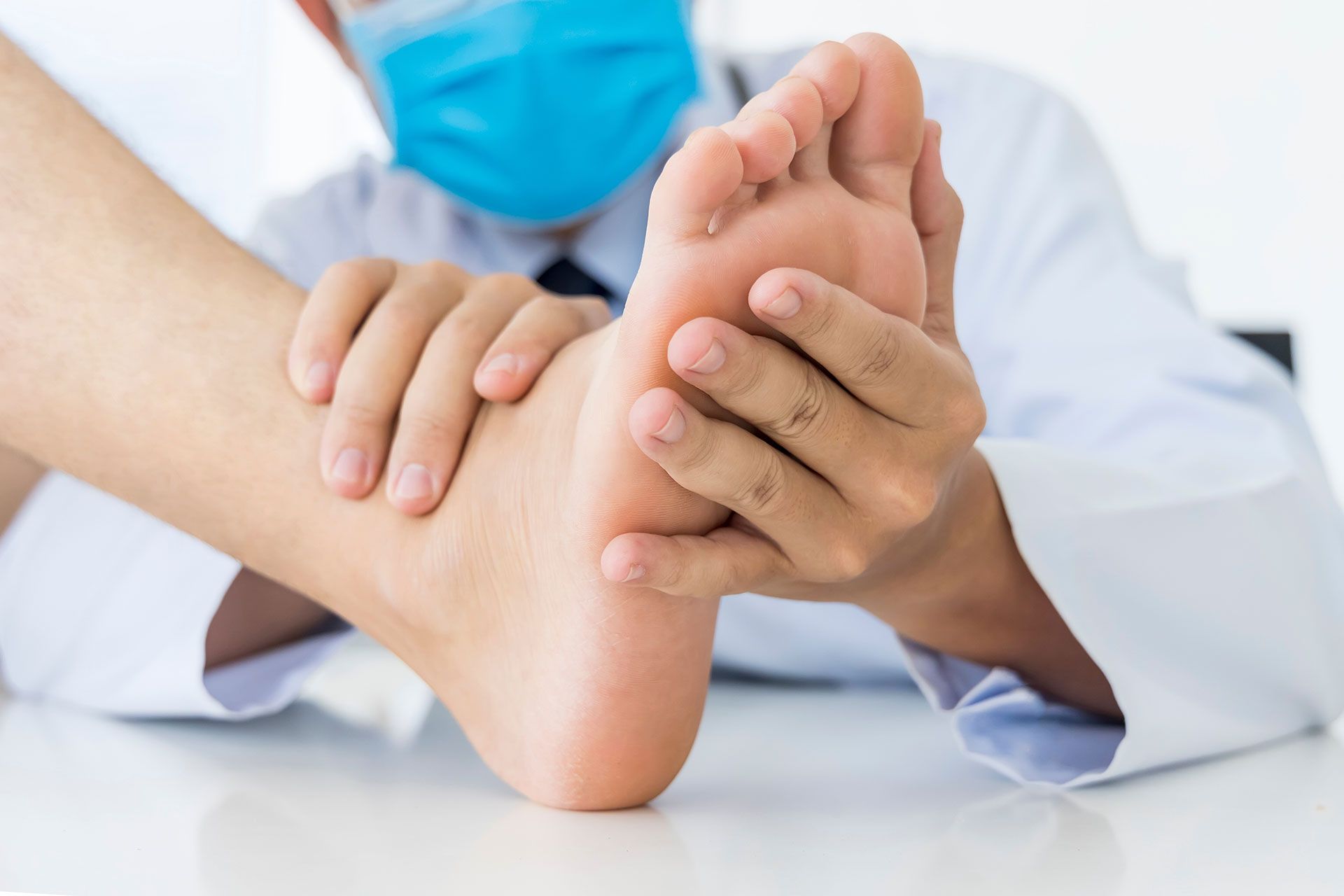 A person is getting a foot massage on a table.