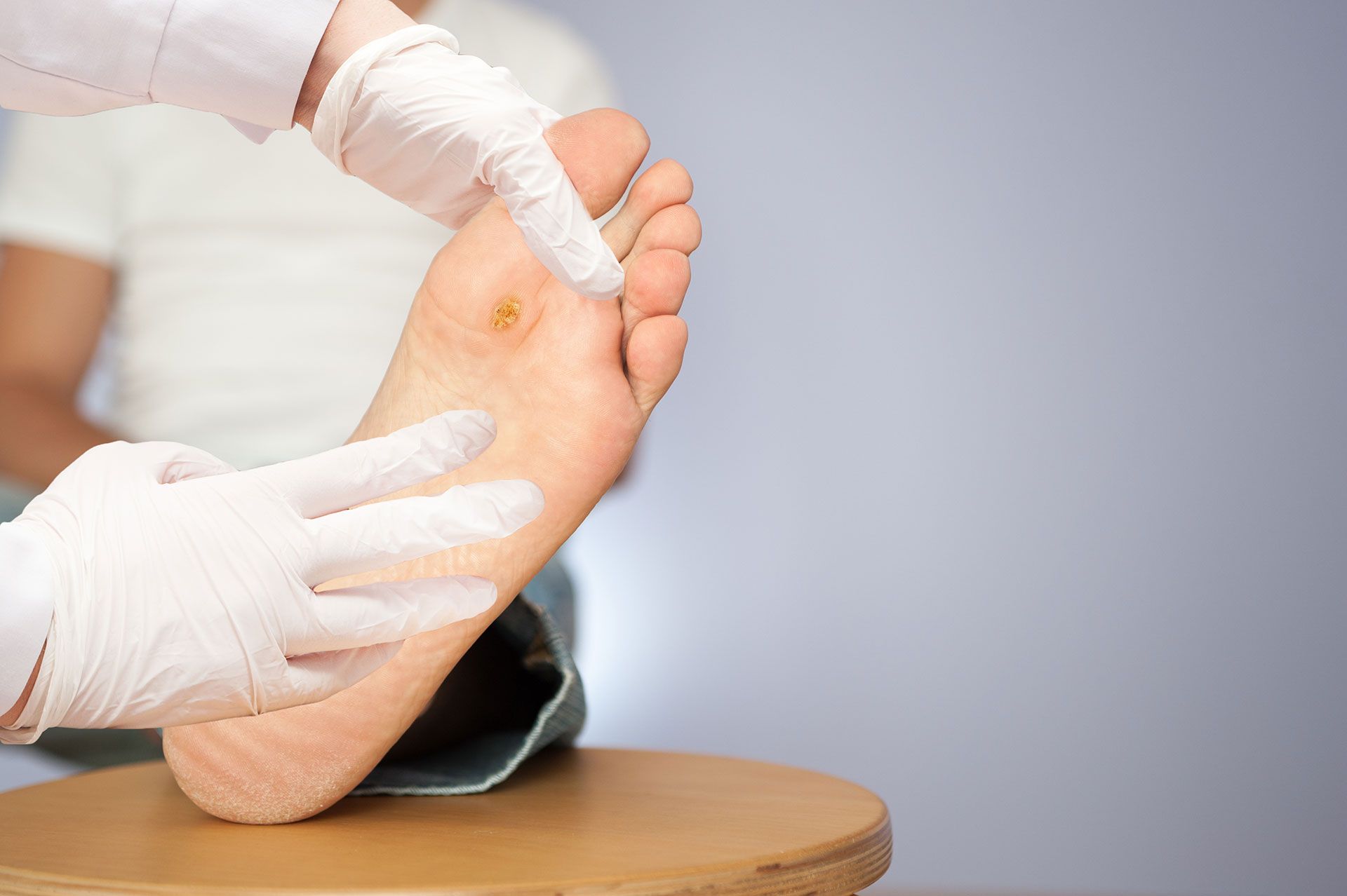 A person is getting a foot massage on a table.
