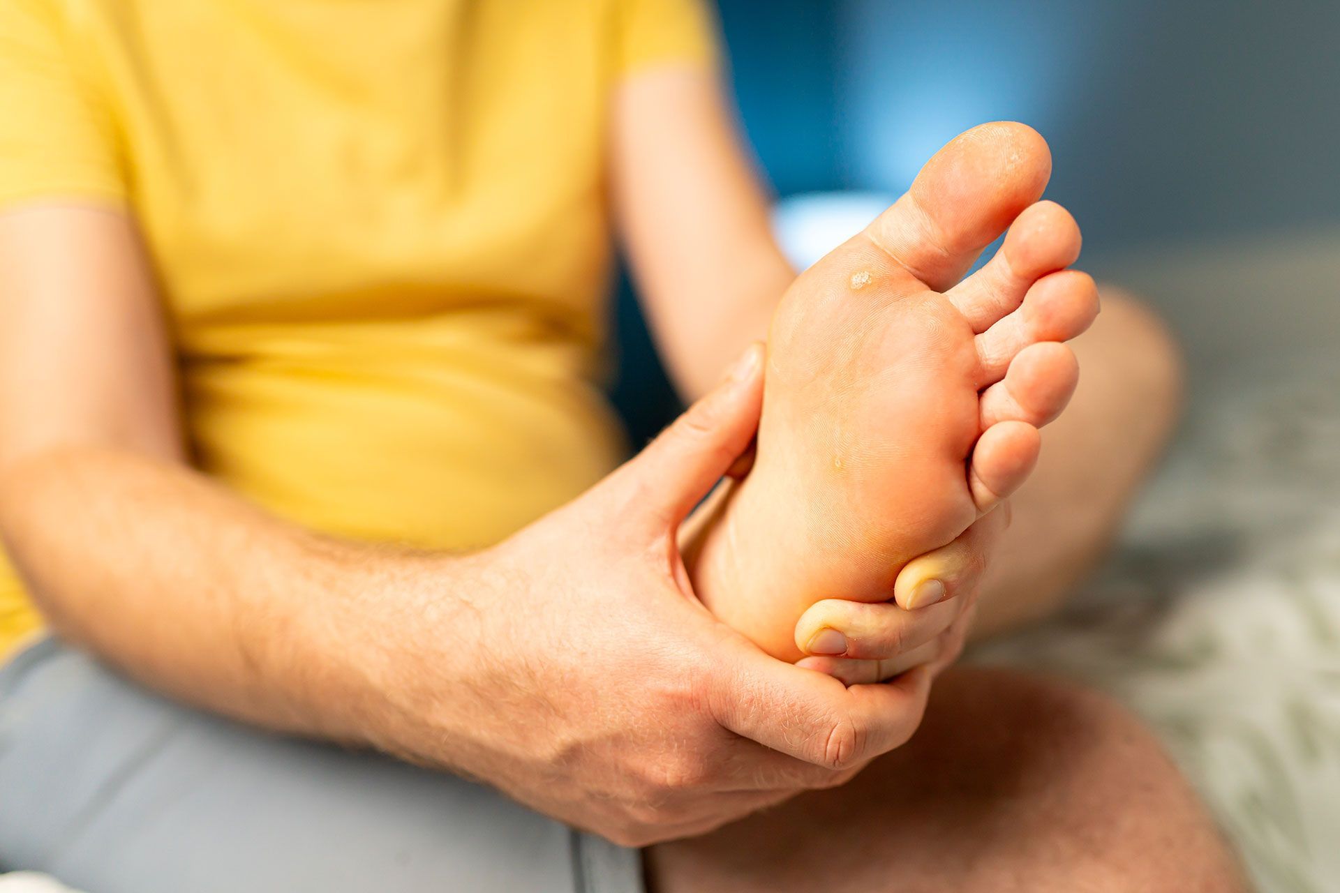 A person is getting a foot massage on a table.