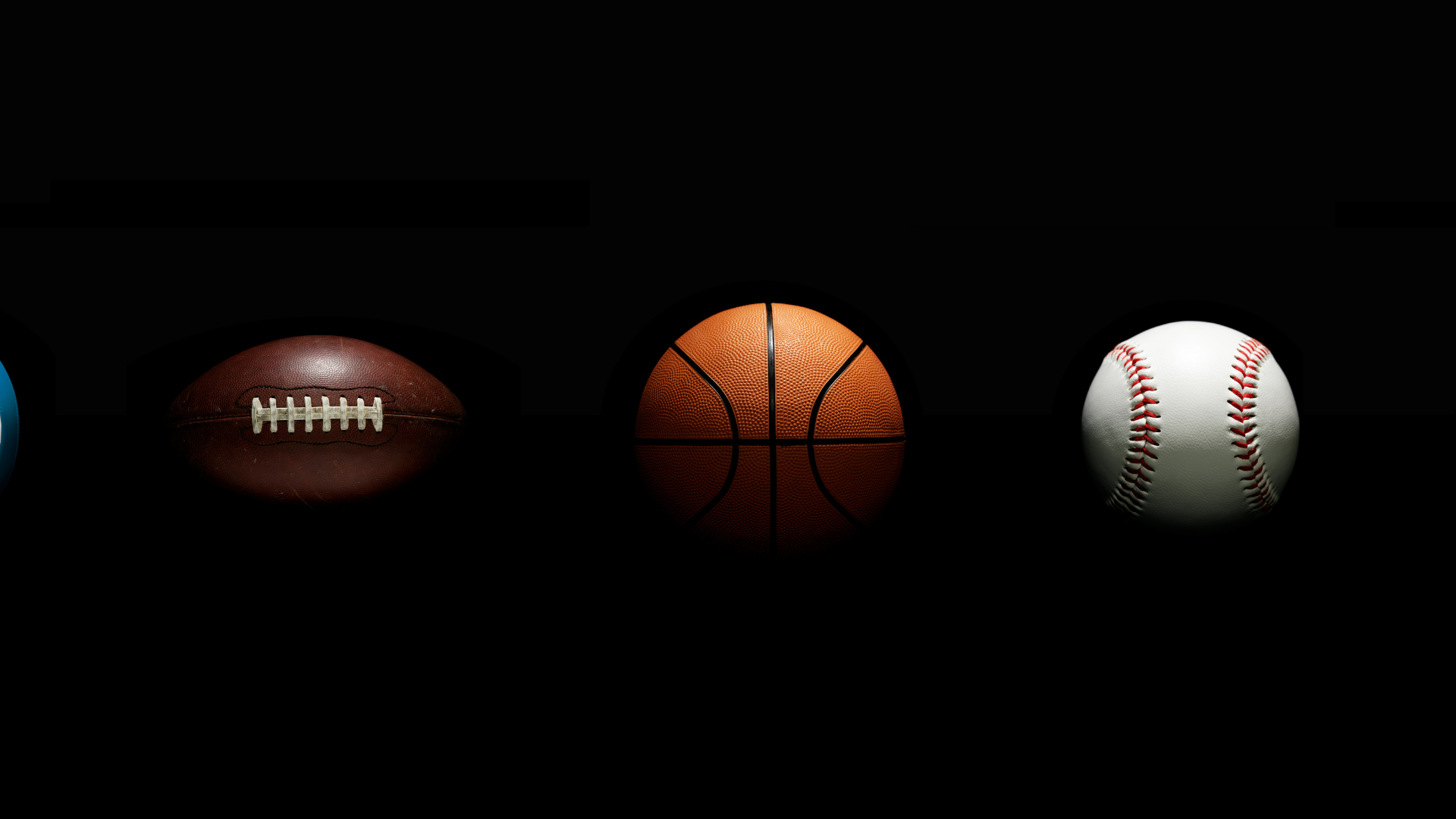 Balls for sports: football, basketball, and baseball against a black background.
