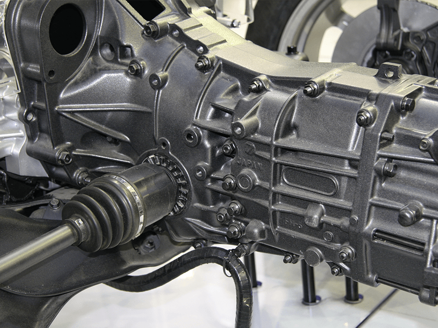 A close up of a car engine and gearbox