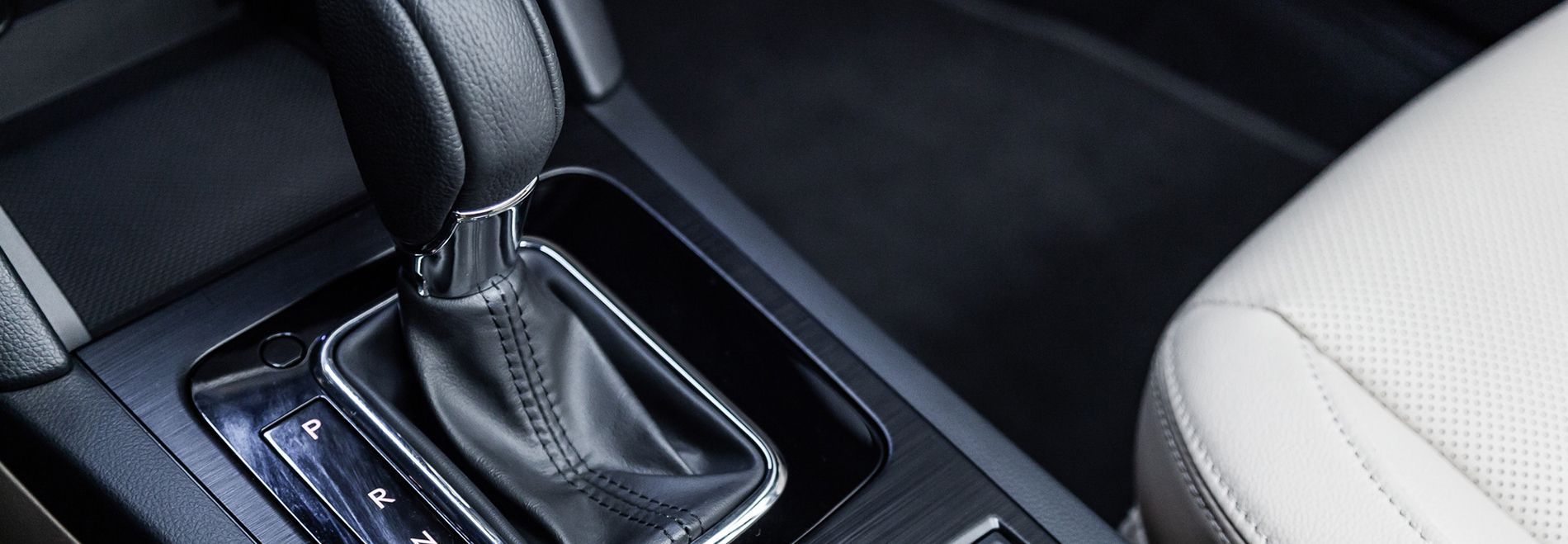 A close up of a shifter in a car.